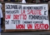 striscione la cura non è reato